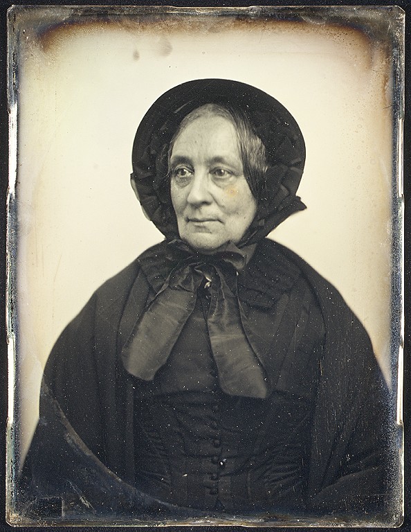 Elderly Woman in Black Cape and Bonnet with Mourning